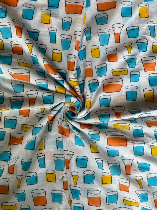 Colourful tumblers hand block printed on white soft cotton fabric