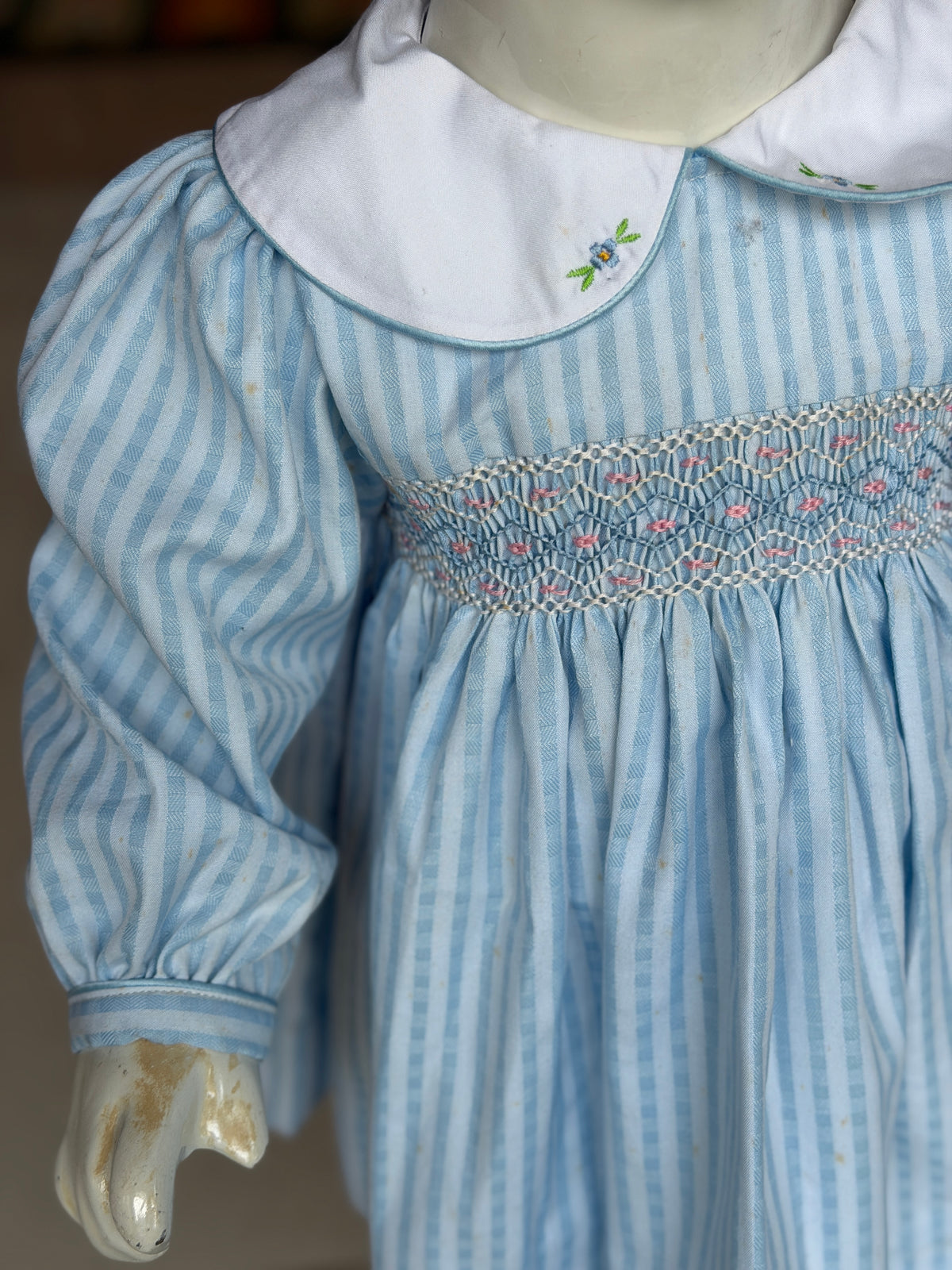Pastel blue stripes smocking cotton frock for girls with embroidered Peter Pan collar and long sleeves