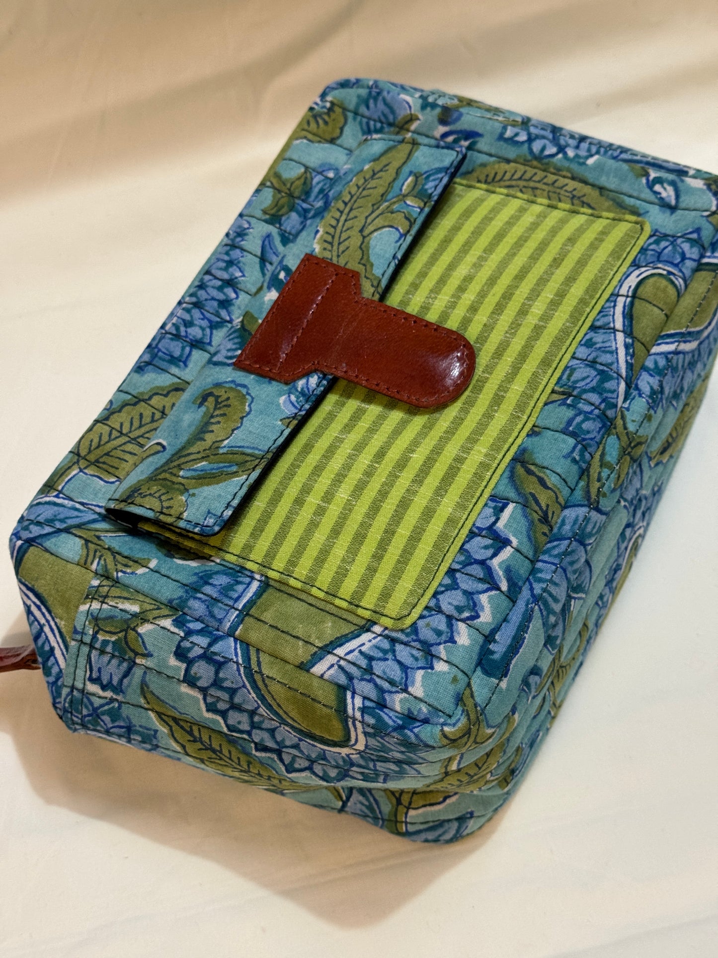 Handcrafted toiletries / travel pouch with leak proof plastic lining plus colorful front pocket with leather patch
