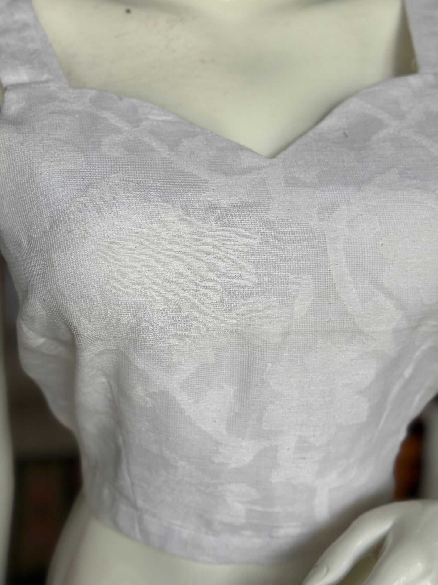 Off White cut work cotton sleeveless blouse