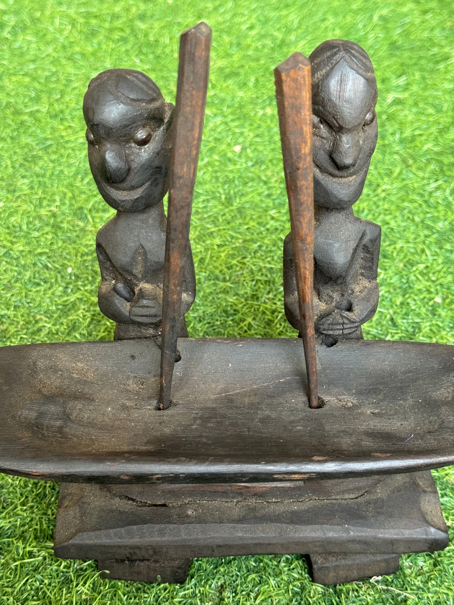 2 people pounding rice - traditional wooden sculpture from Nagaland