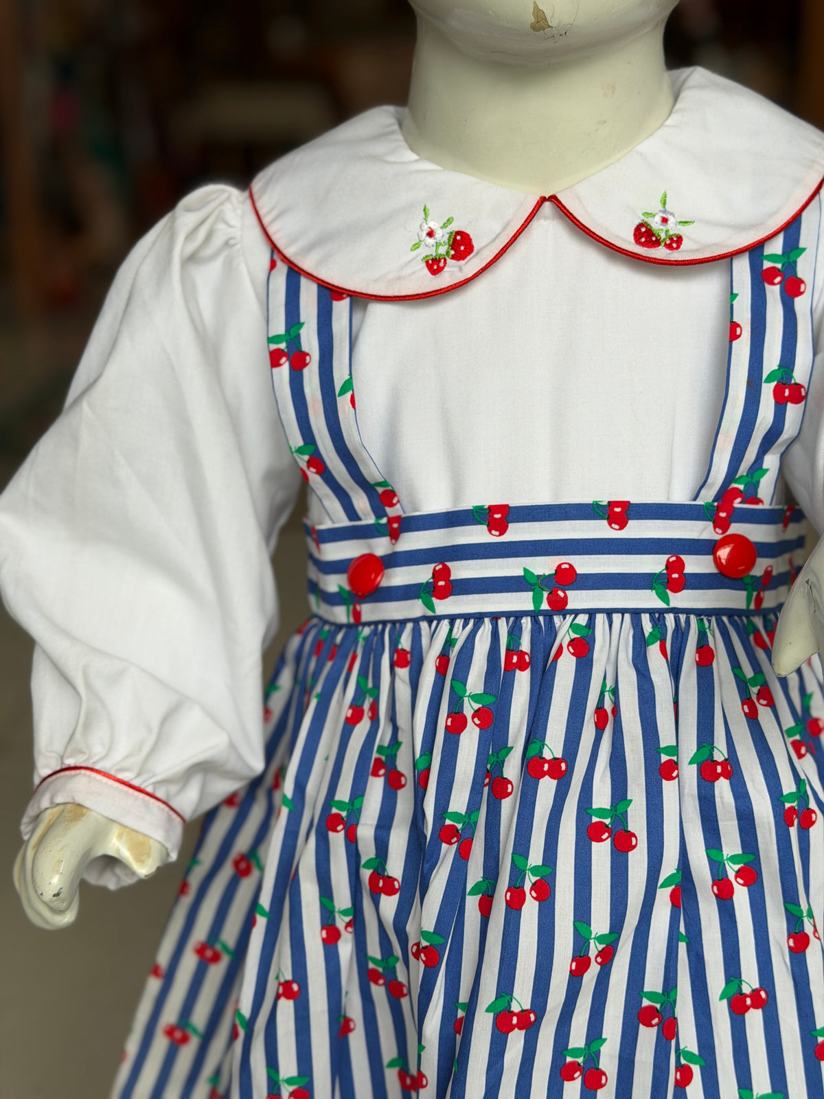 Blue and white stripes cherries print suspender look cotton frock with attached white embroidered collared top for girls