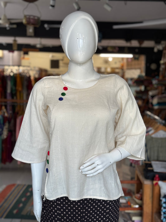 Off white handwoven cotton top with colorful buttons