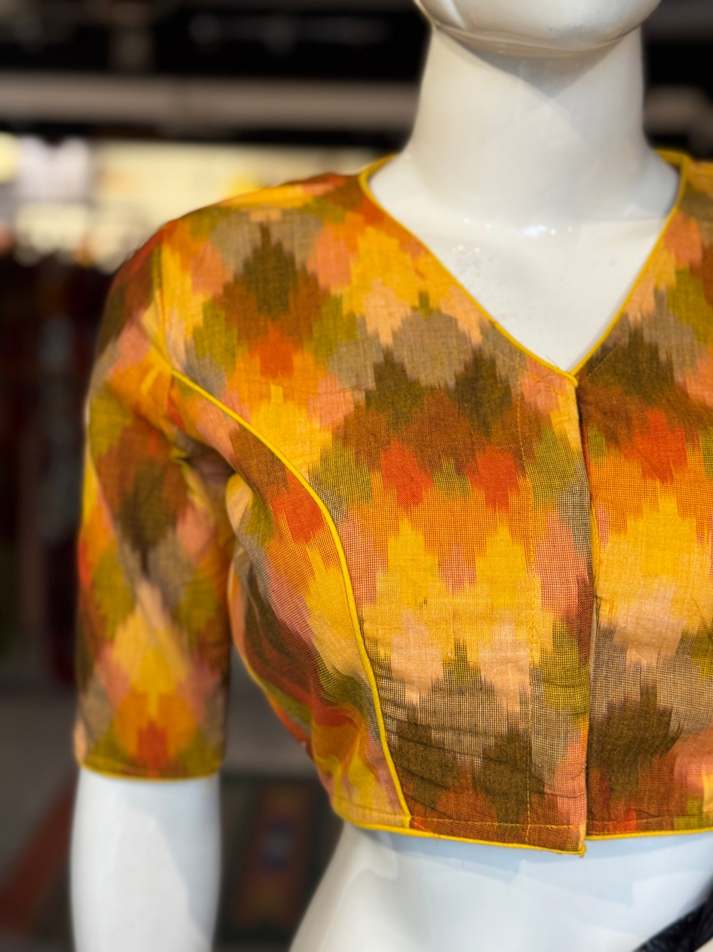 Shades of sun - yellow, orange handloom ikat cotton blouse with piping details and lining