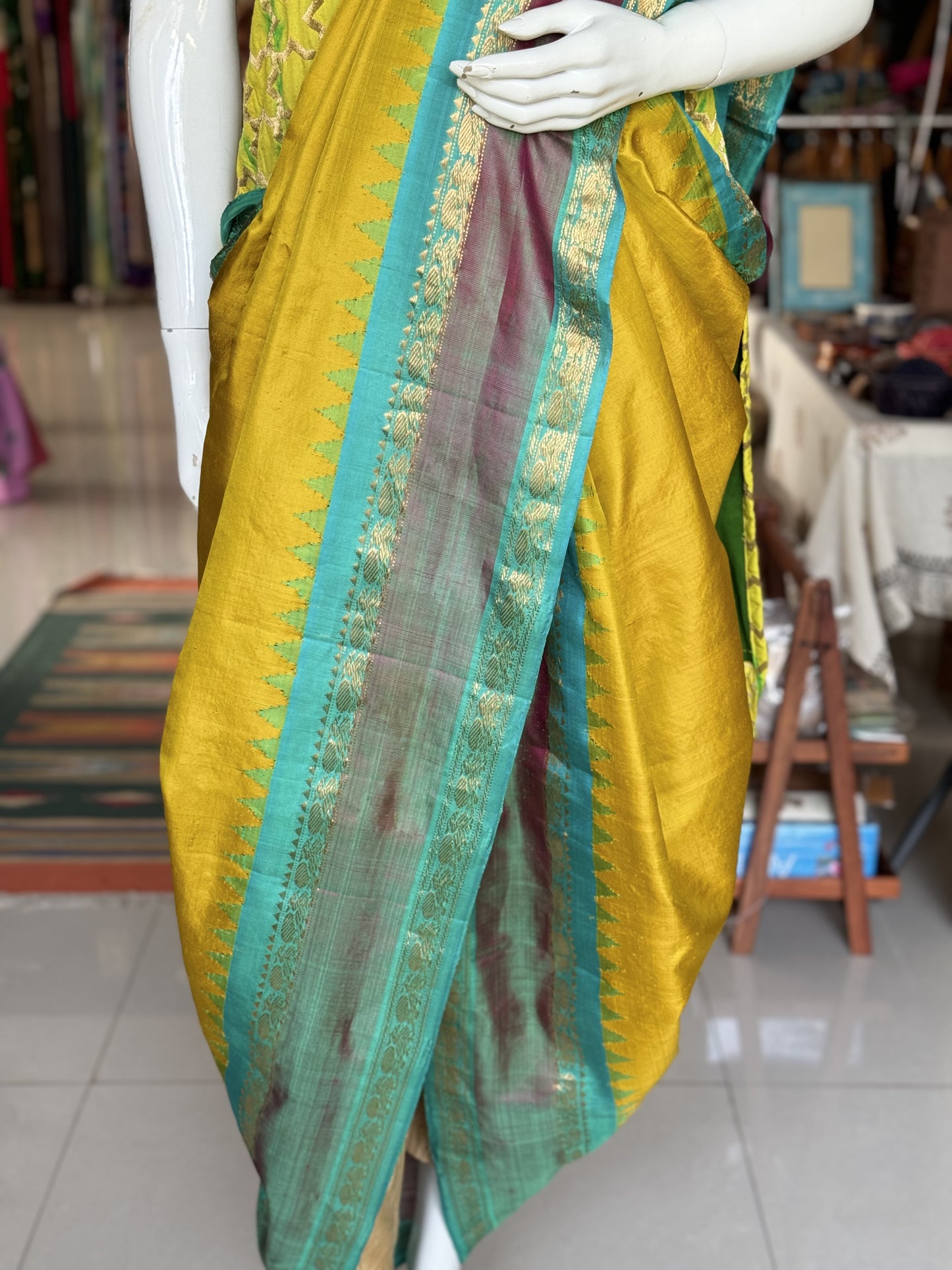 Beautiful mustard and green combination pure silk handwoven Gadwal saree with temple borders