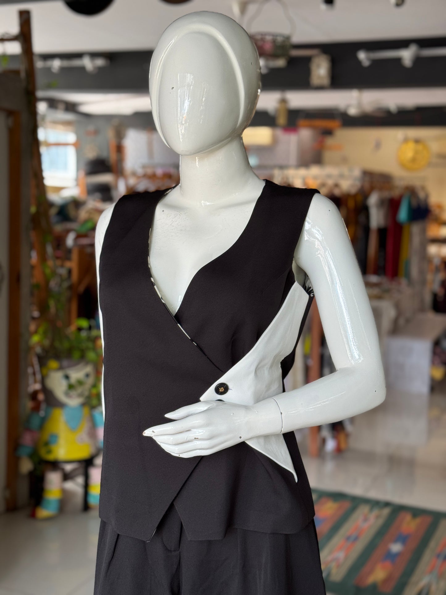 Black and white women’s vest style top