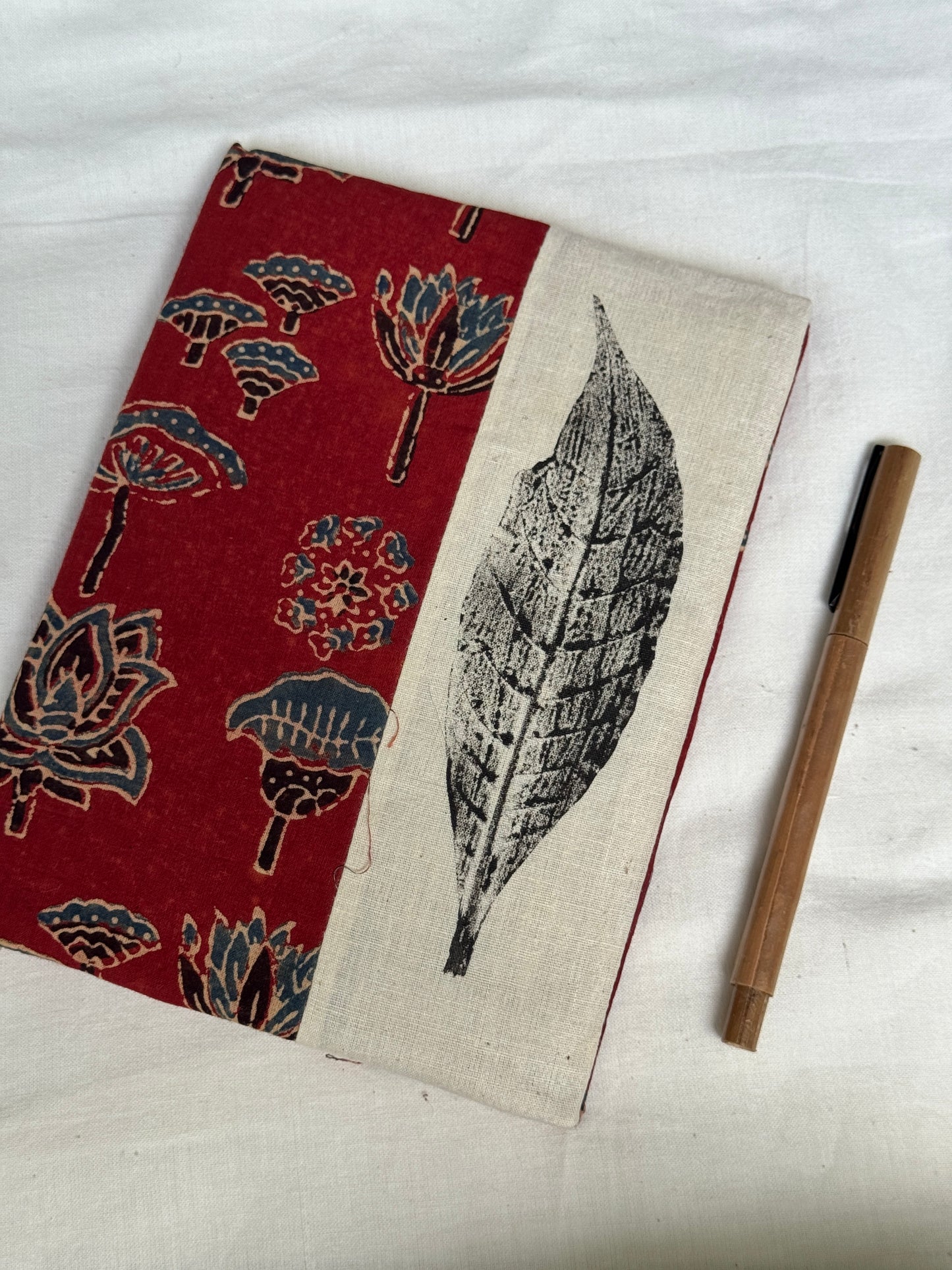 Handmade paper notebooks with hand eco printed fabric cover