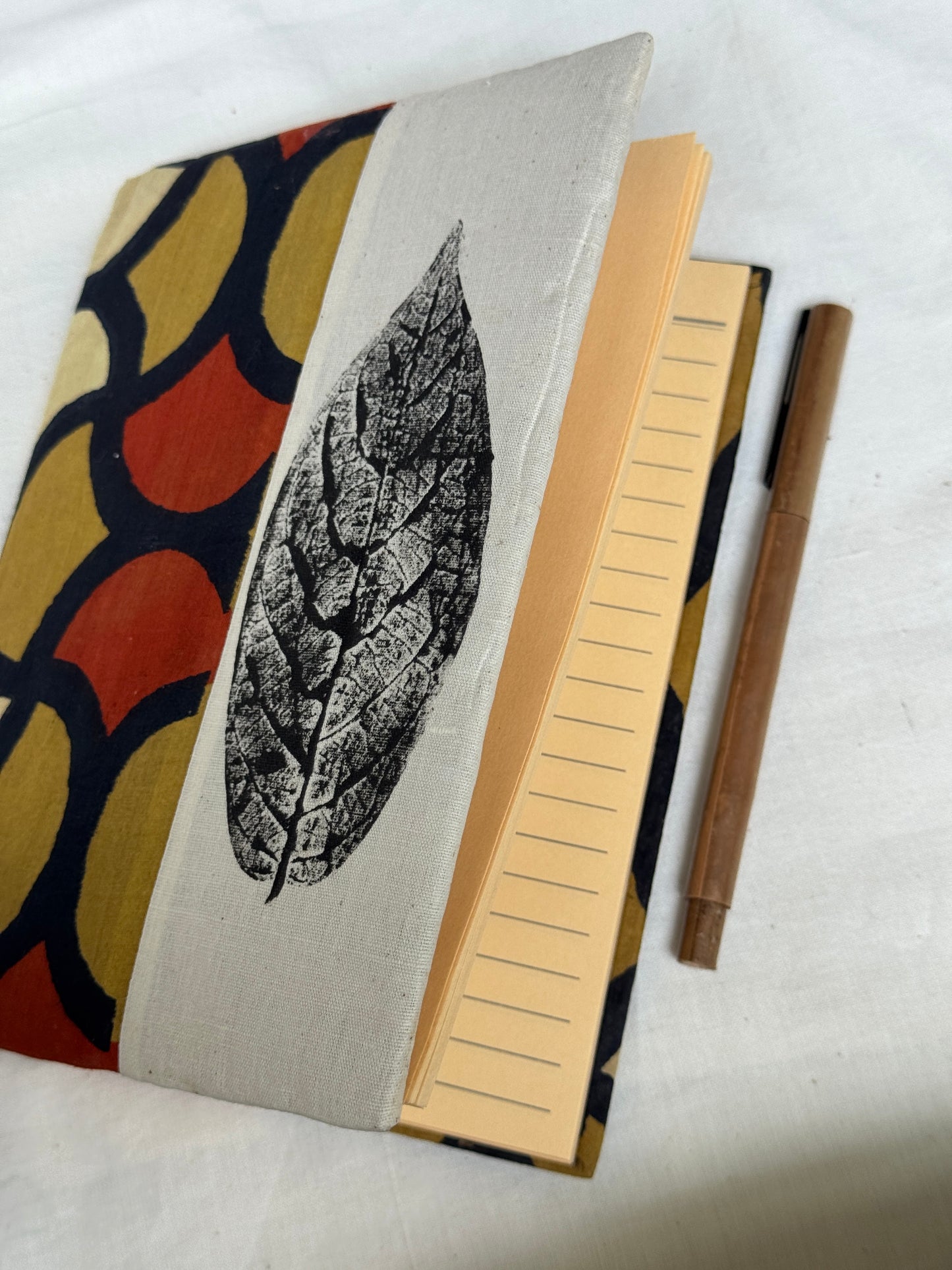Handmade paper notebooks with hand eco printed fabric cover