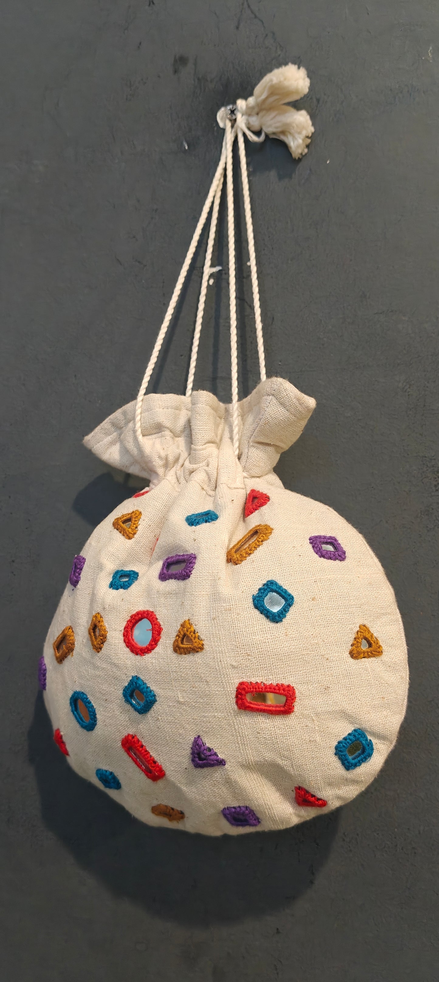 Offwhite cotton potli with mirror work - hand embroidered