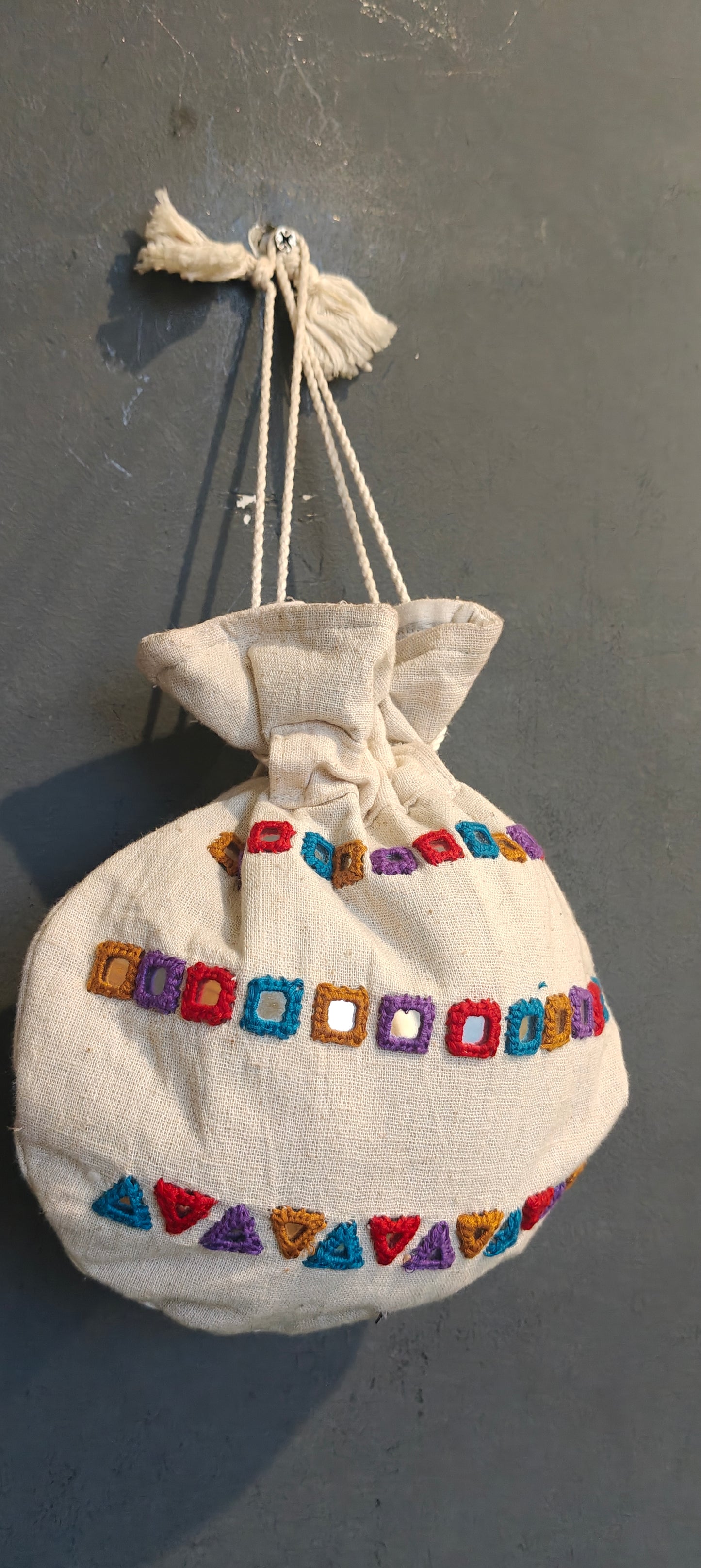Offwhite cotton potli with mirror work - hand embroidered