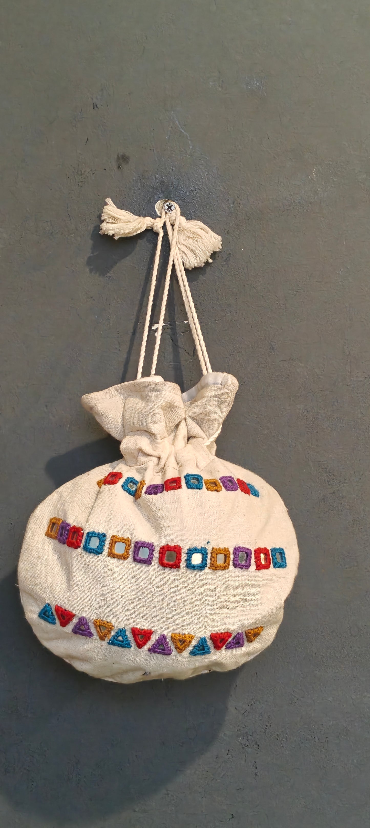 Offwhite cotton potli with mirror work - hand embroidered