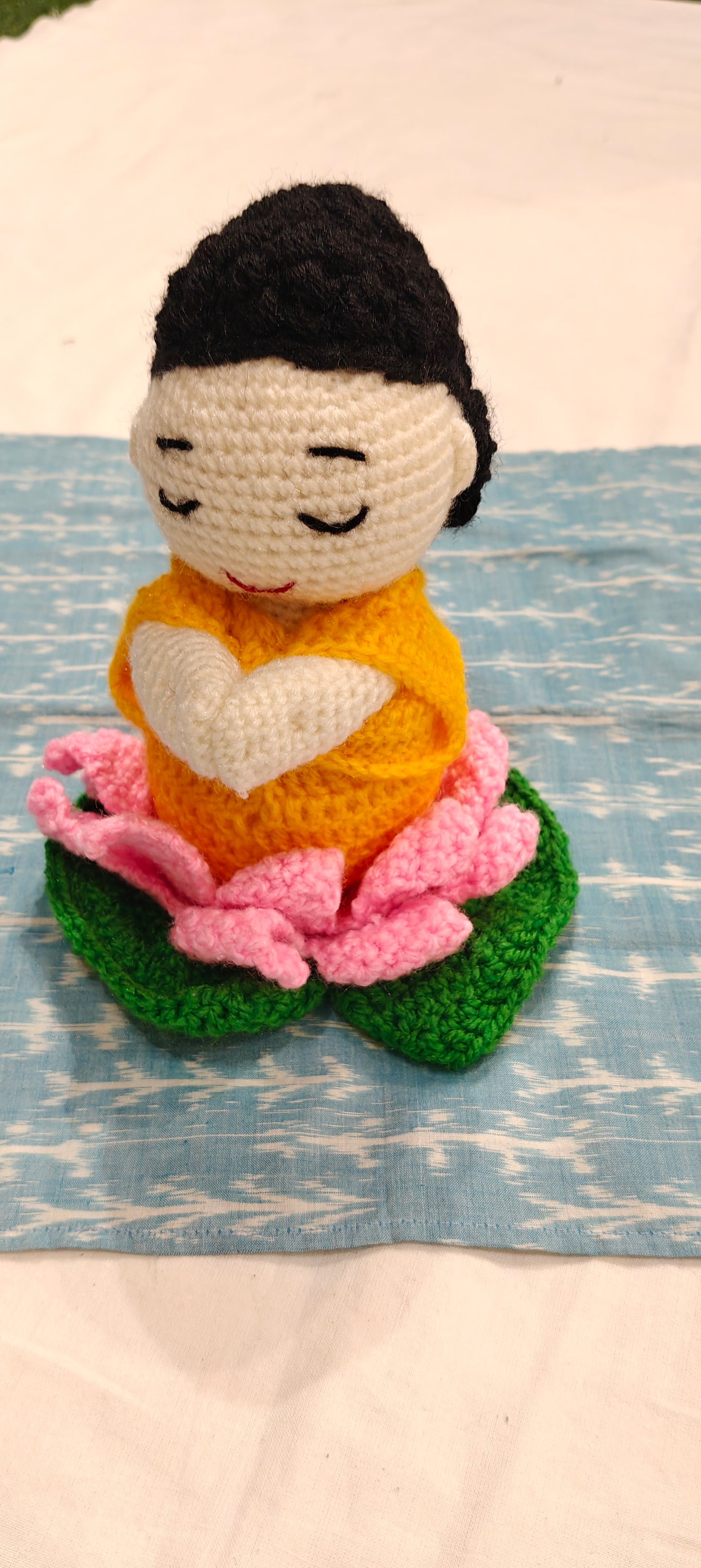 Crochet doll of buddha meditating on a lotus - handcrafted crochet