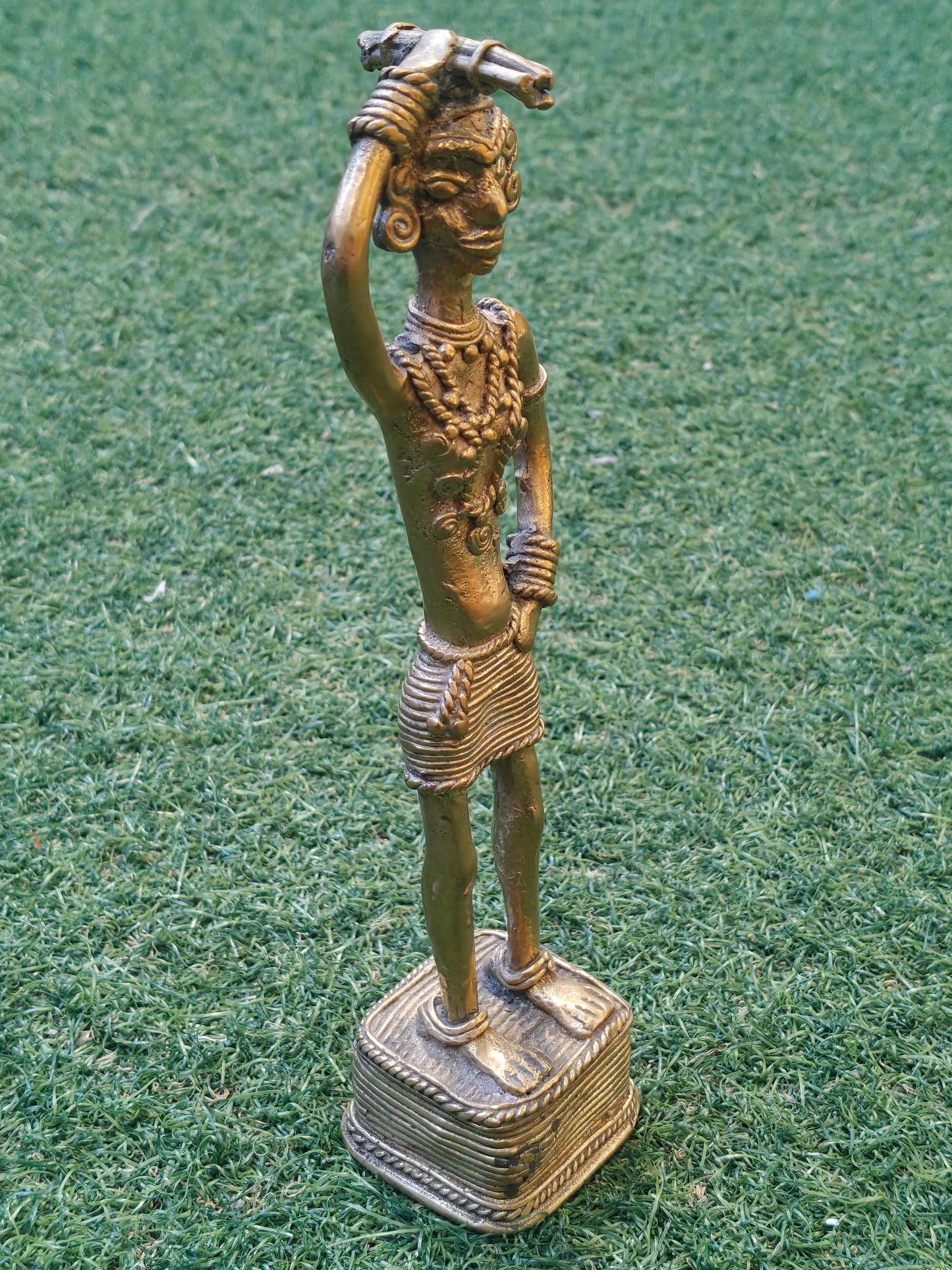 A woman carrying fire wood - Dokra Brass handcrafted decor