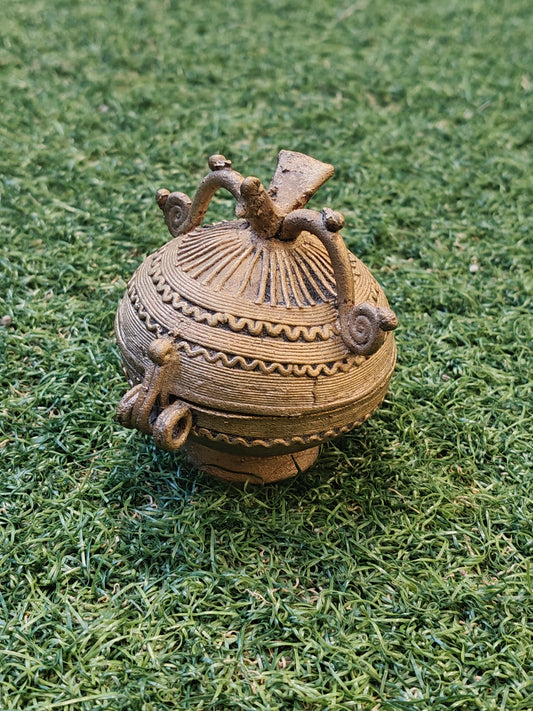Brass spherical coin box with a bird on top - Dokra Brass handcrafted decor
