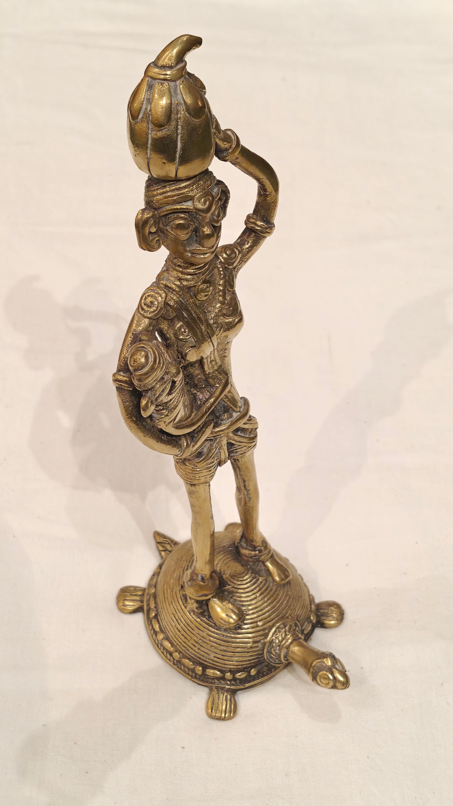 A Mother carrying her baby and standing on a tortoise - Handcrafted brass decor