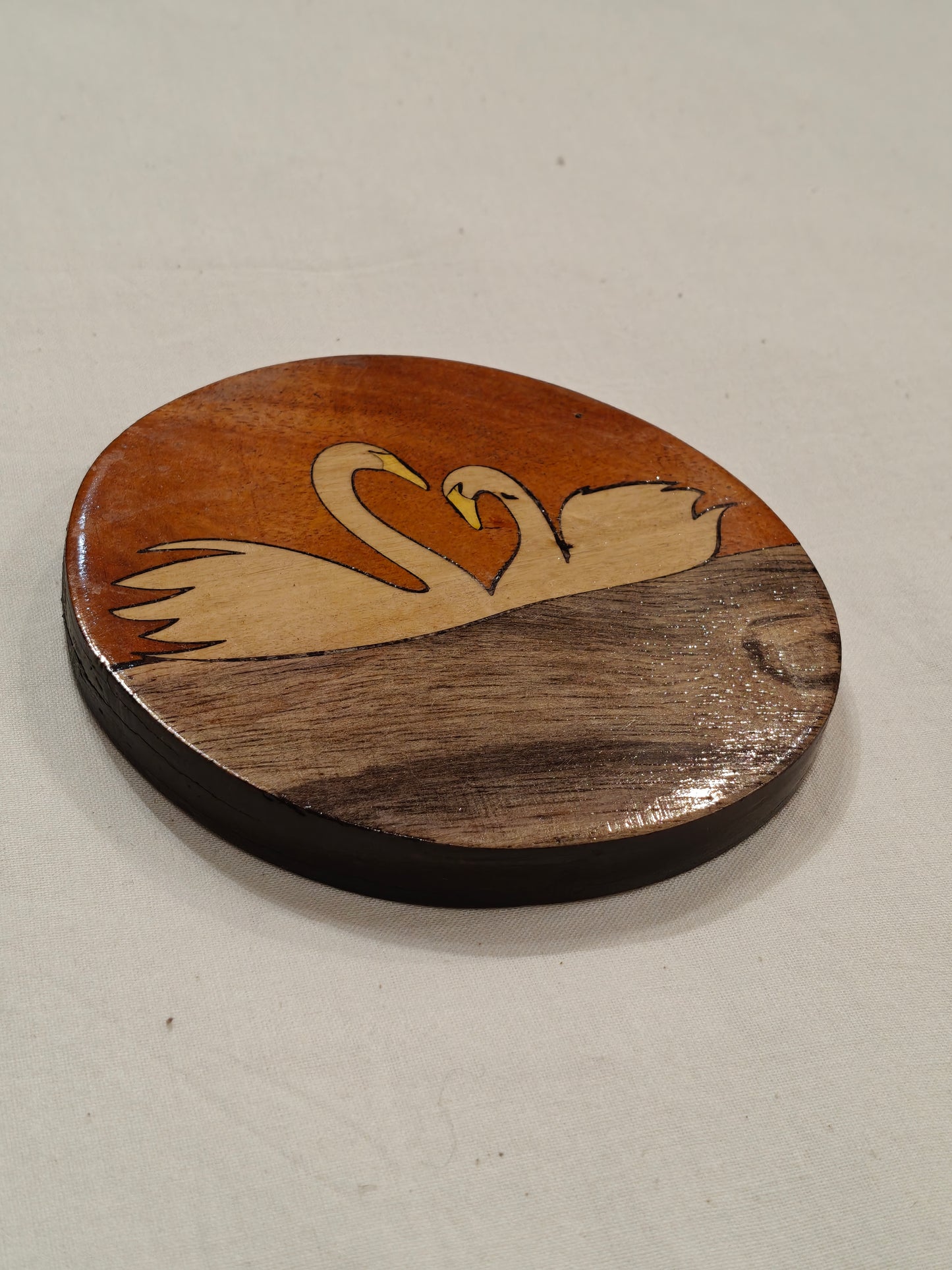 Handcrafted Wooden coaster with Swans design on it