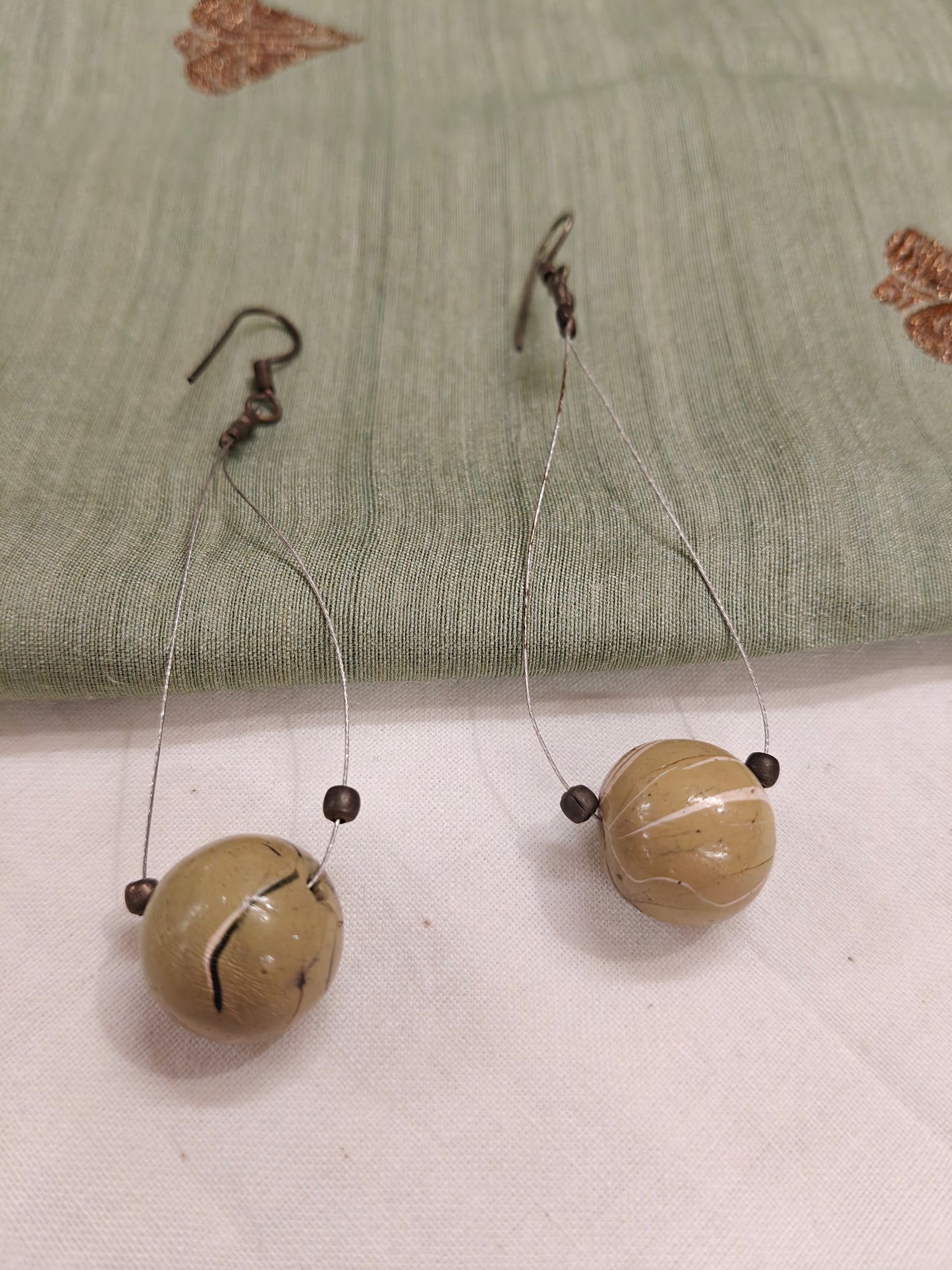 Green stone centred bead earrings