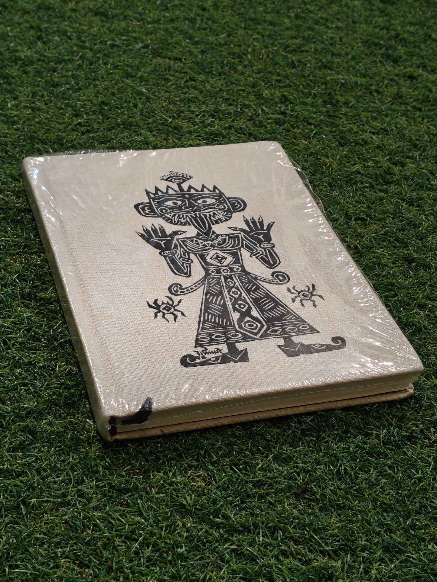 Ruled paper note book / journal with a hand painted man printed on the cover