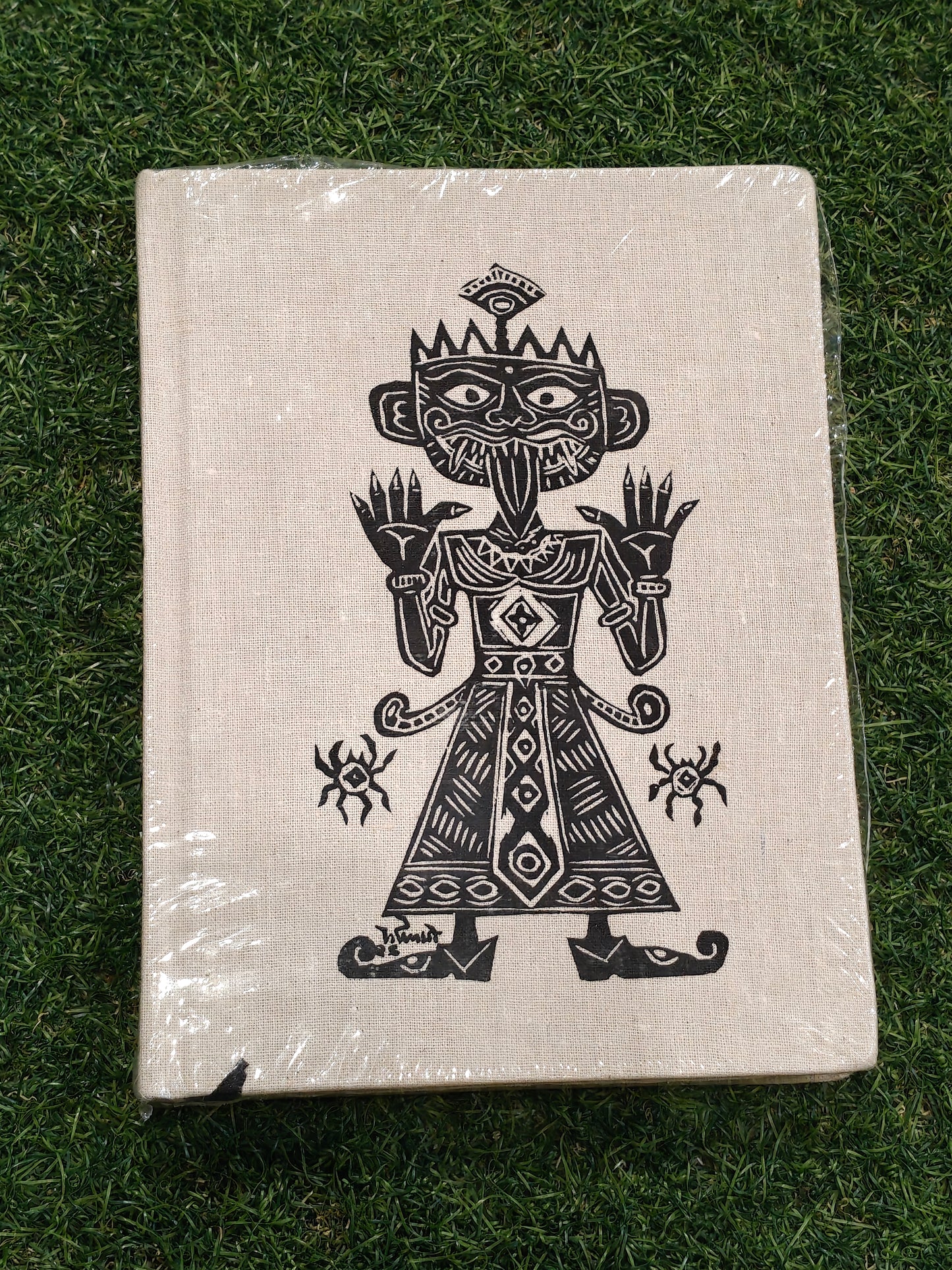 Ruled paper note book / journal with a hand painted man printed on the cover