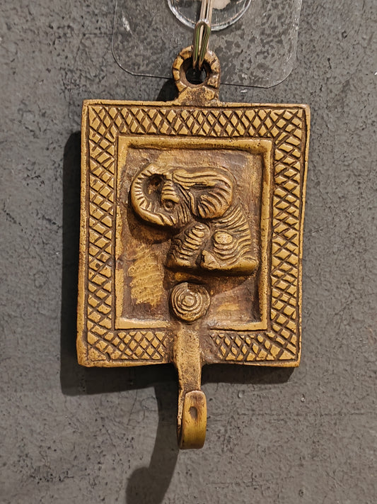 Handcrafted  hangers with figures carved on it - brass