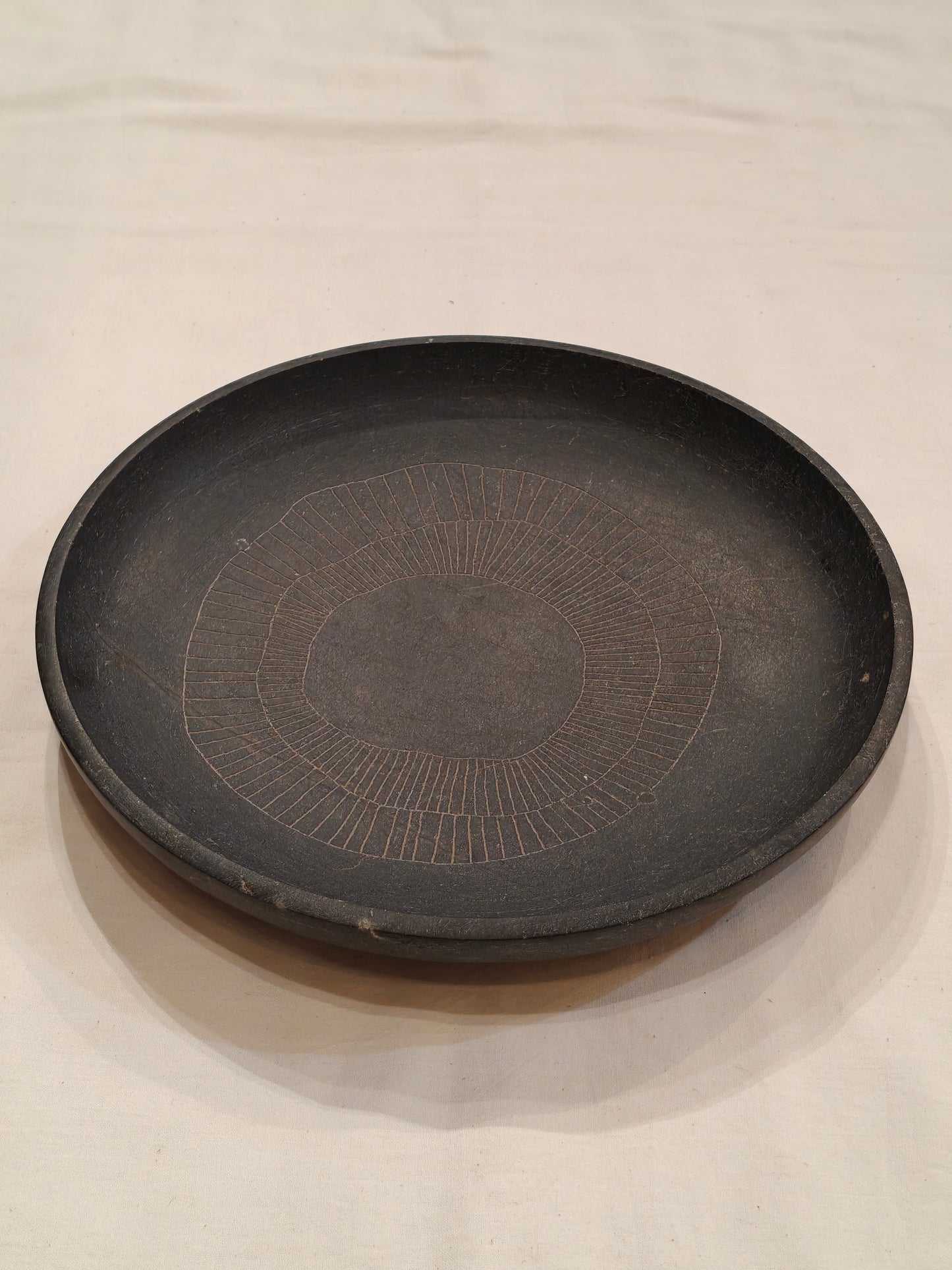 Black granite handcrafted round stone tray with etched design