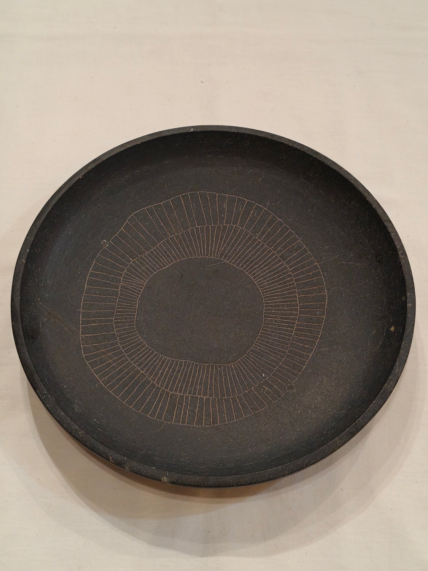 Black granite handcrafted round stone tray with etched design