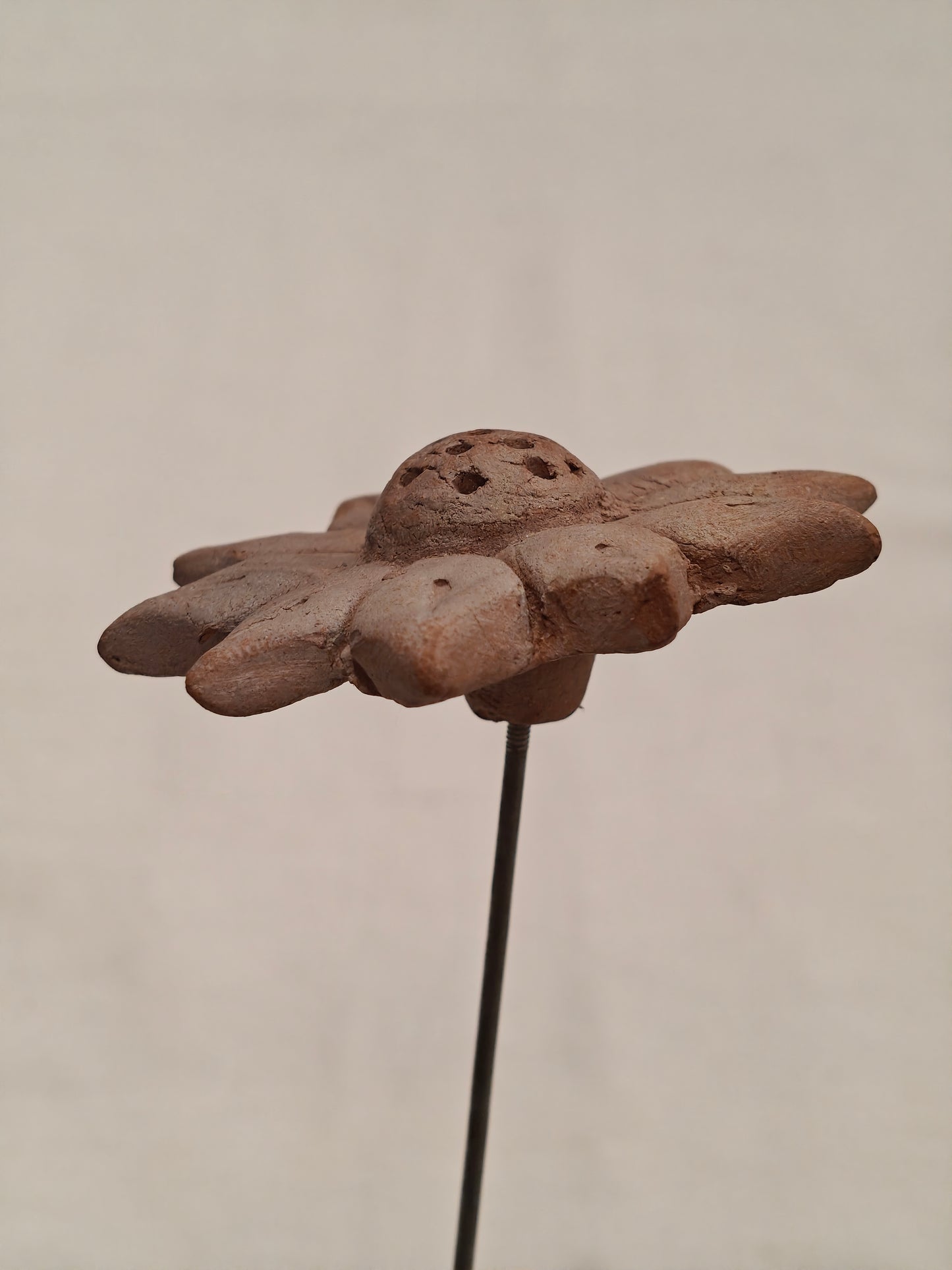 Handcrafted with clay garden stick