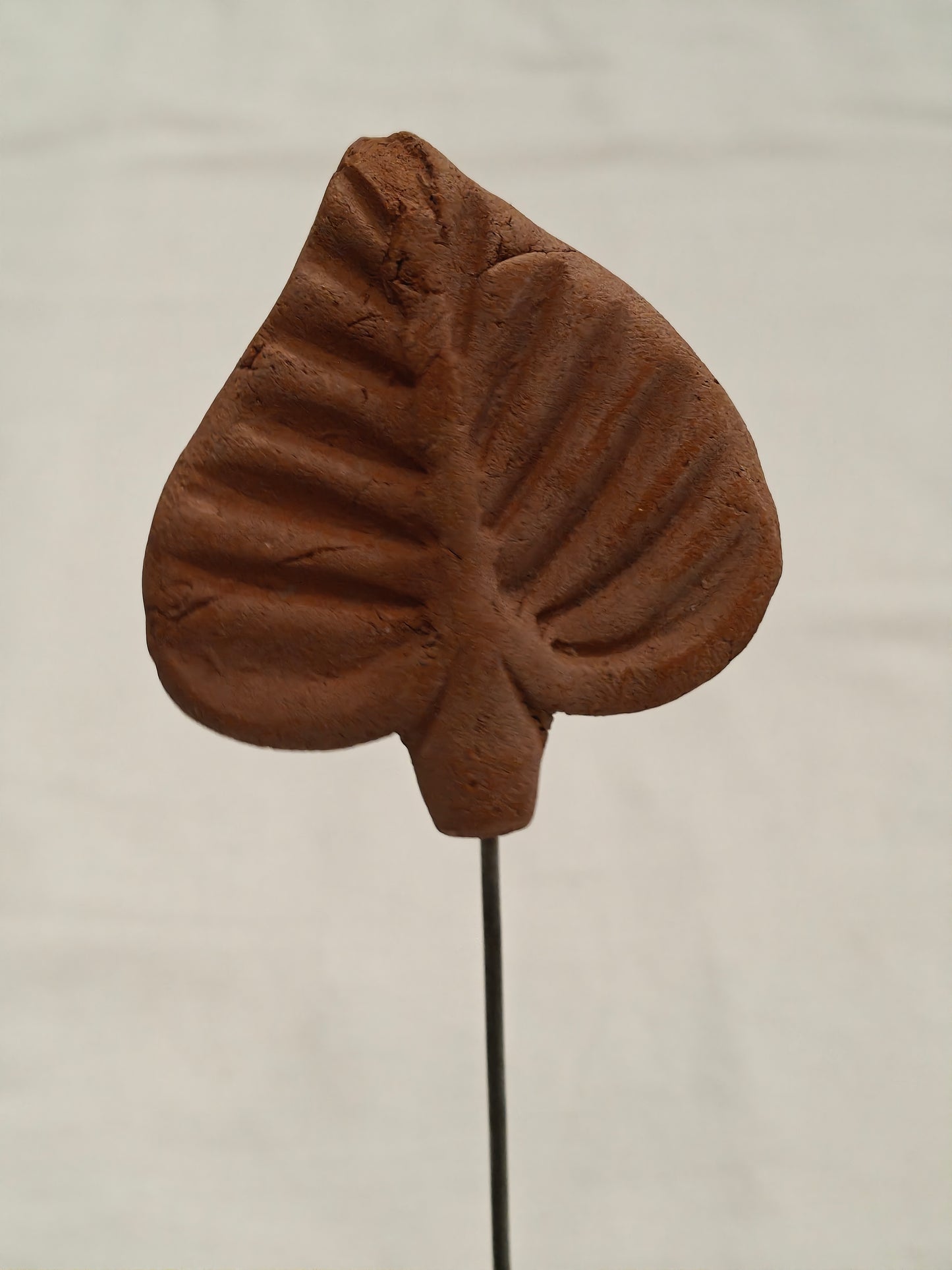 Handcrafted with clay garden stick