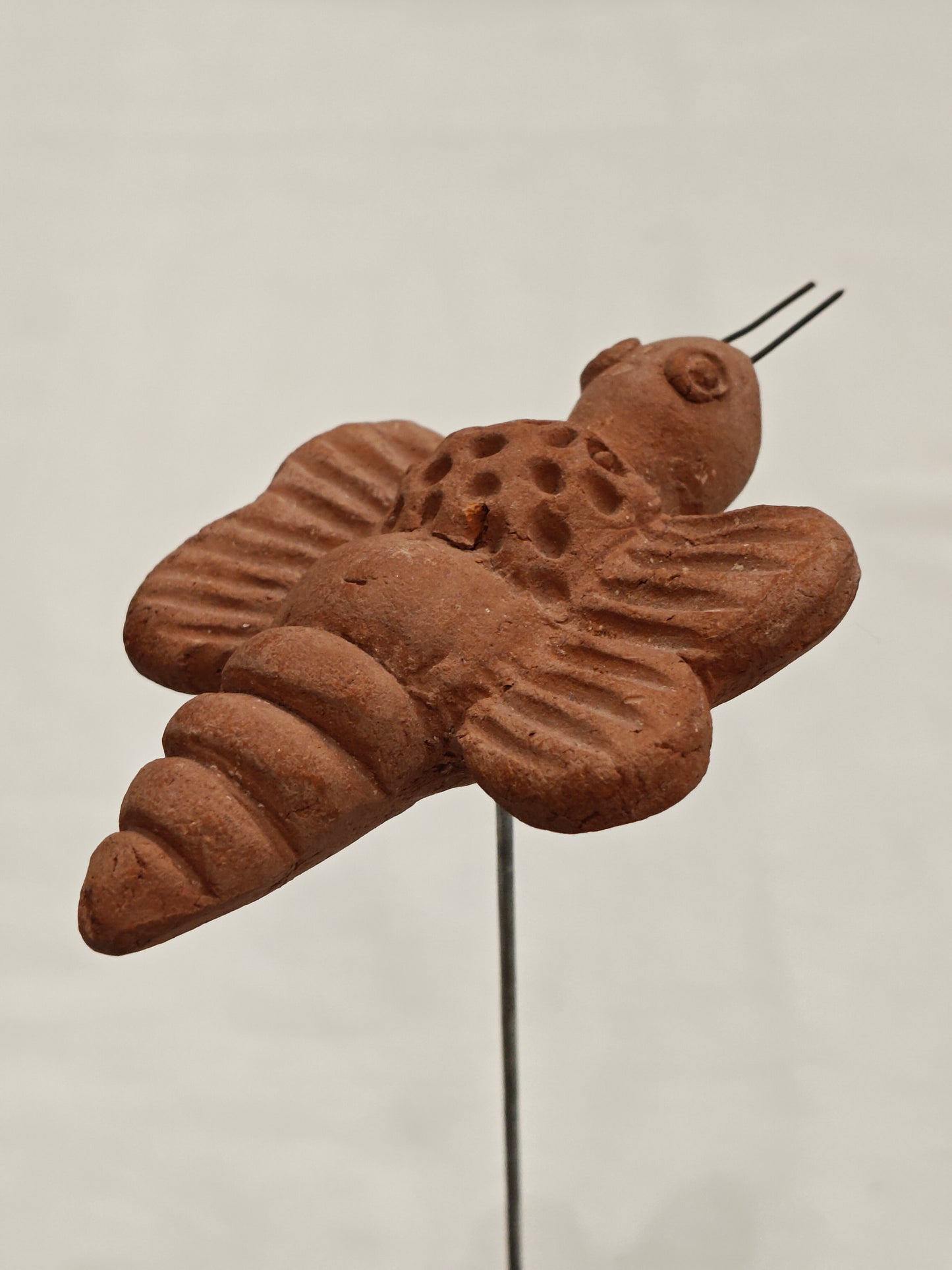 Handcrafted with clay garden stick