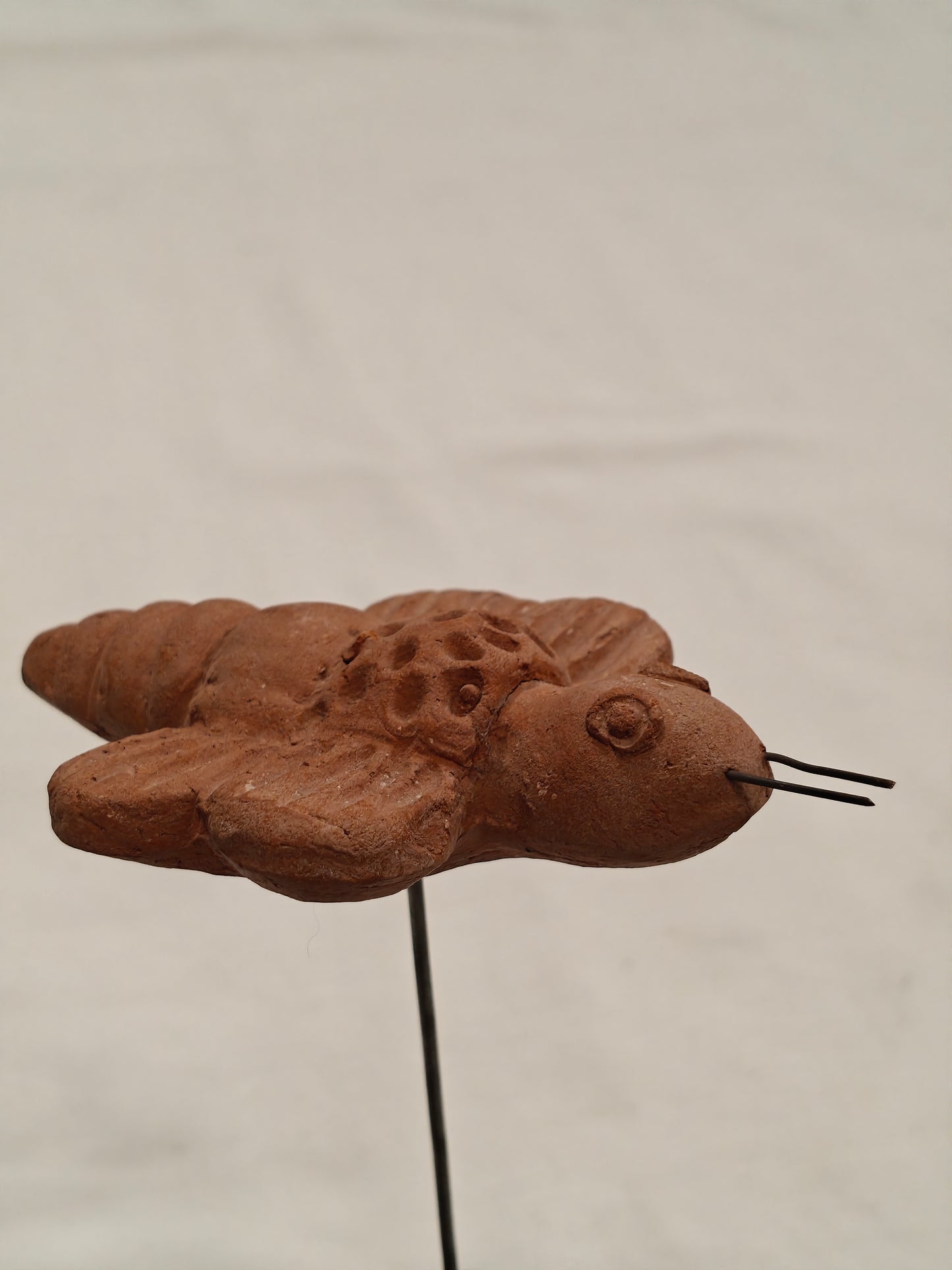 Handcrafted with clay garden stick