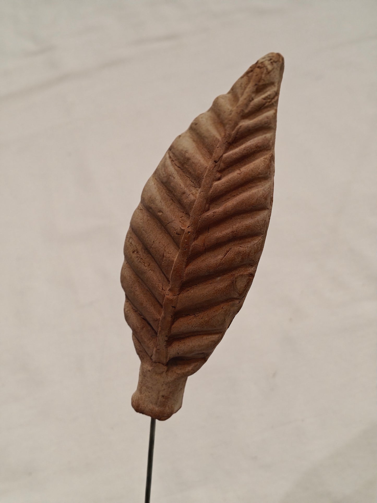 Handcrafted with clay garden stick