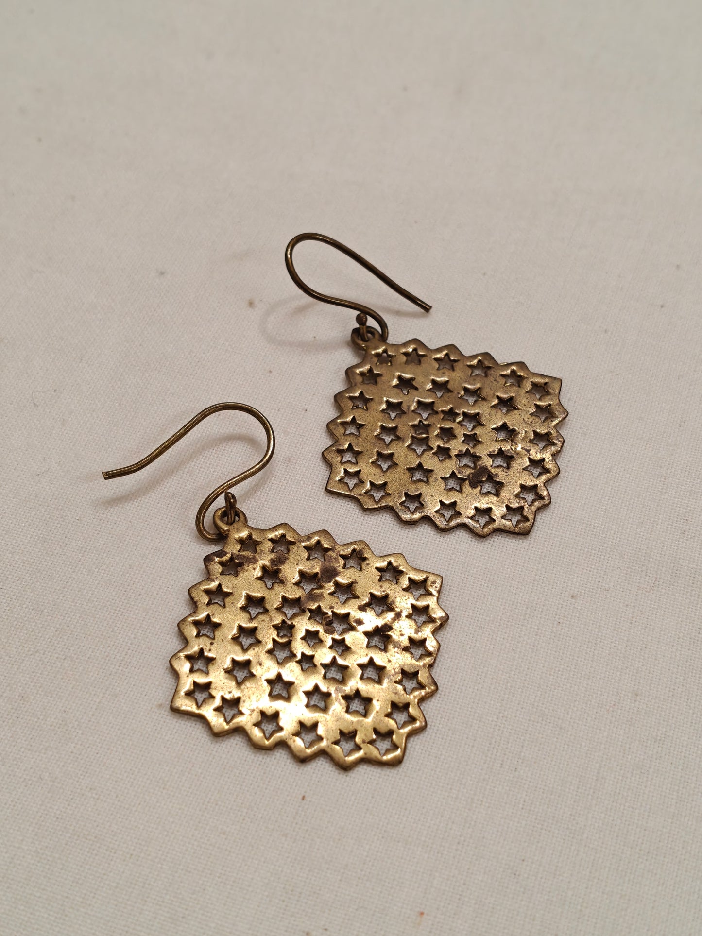 Stars cut work copper ear rings