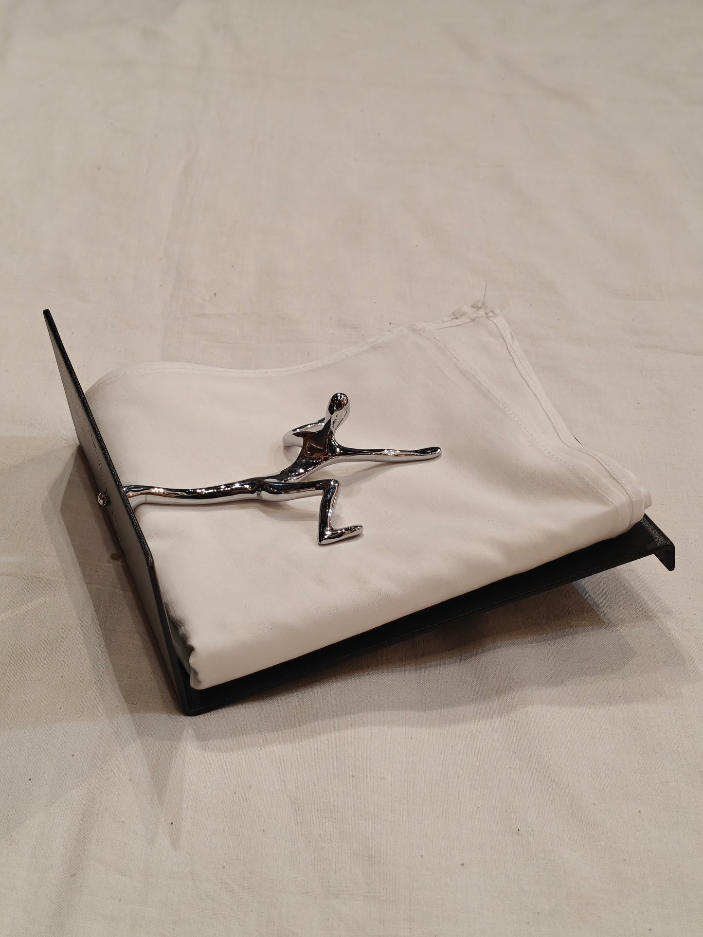 Quirky napkin holder - man all over the place to save your tissues from flying off