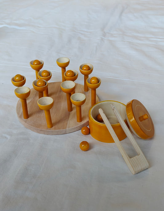 Wooden ball picking game with 12 balls, base, 12 cups, tong and a container