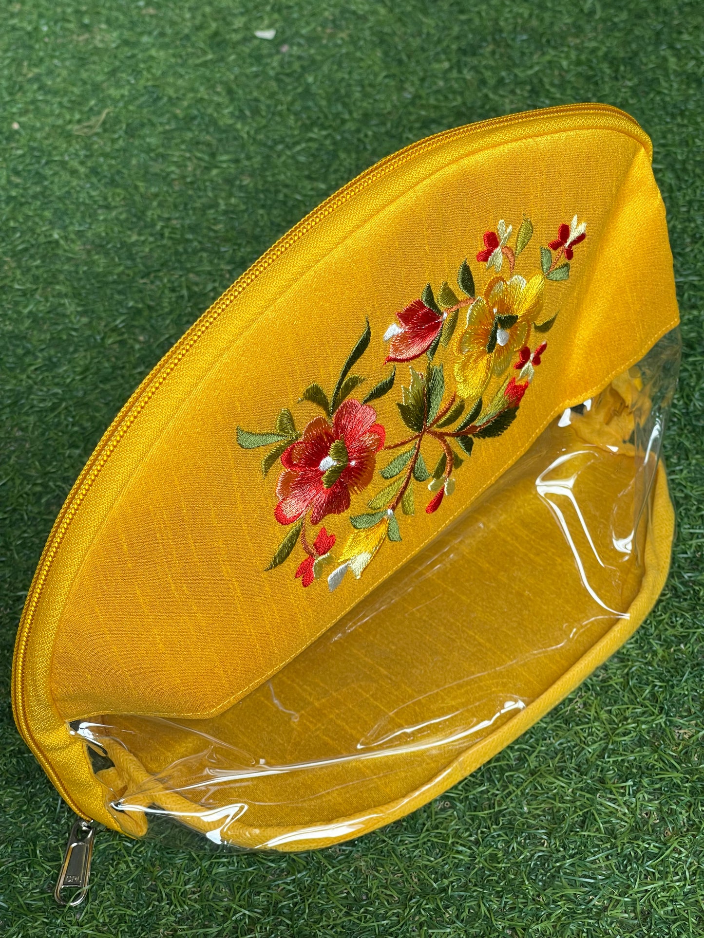 Yellow embroidered transparent toiletries / gifting pouch with zipper closure