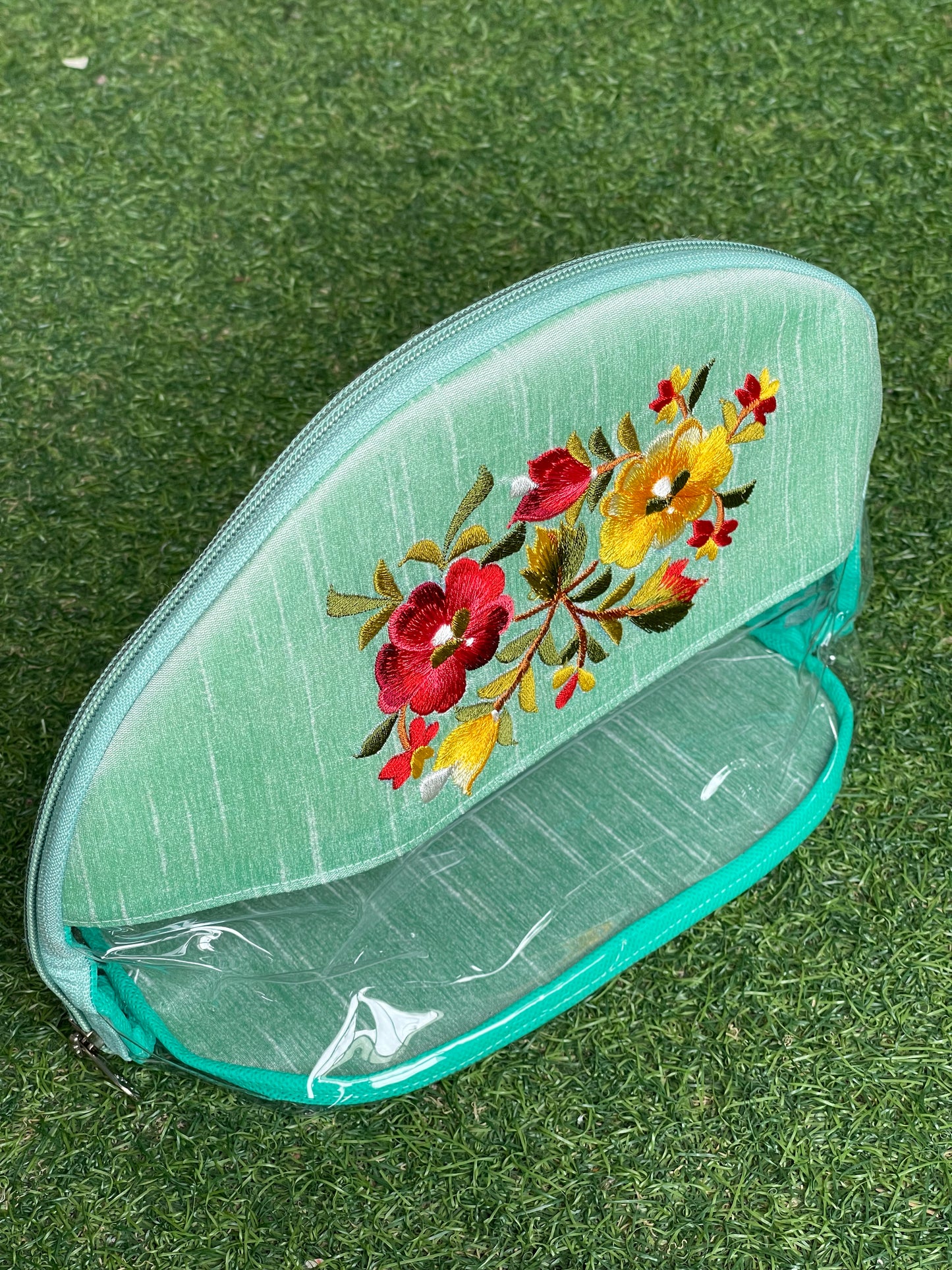 Sea green embroidered transparent toiletries / gifting pouch with zipper closure