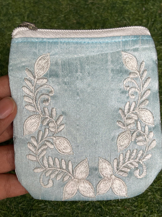 Light blue embroidered fabric based gifting / coin pouch with zipper closure