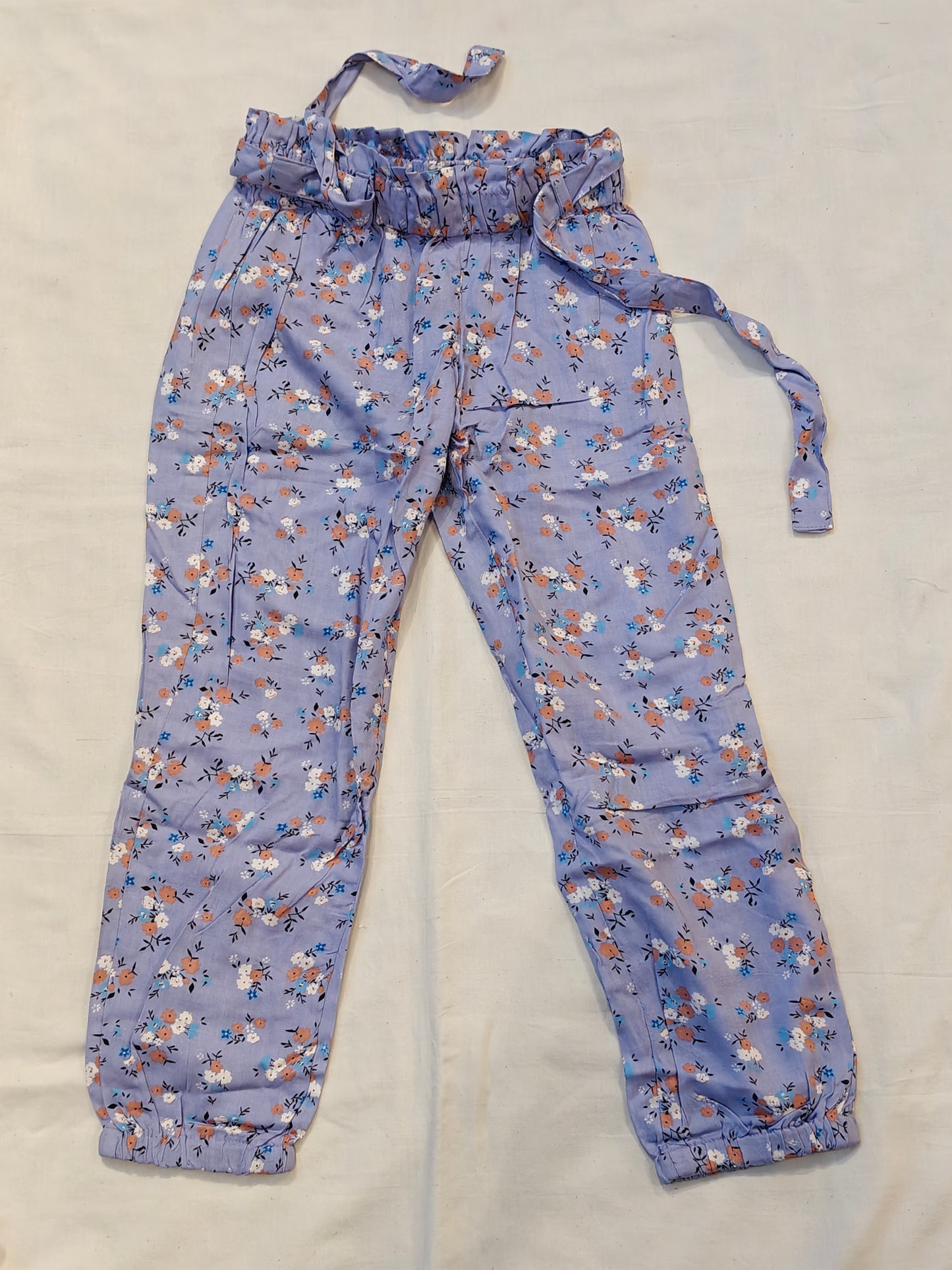 Rayon pants with floral prints and waist belt