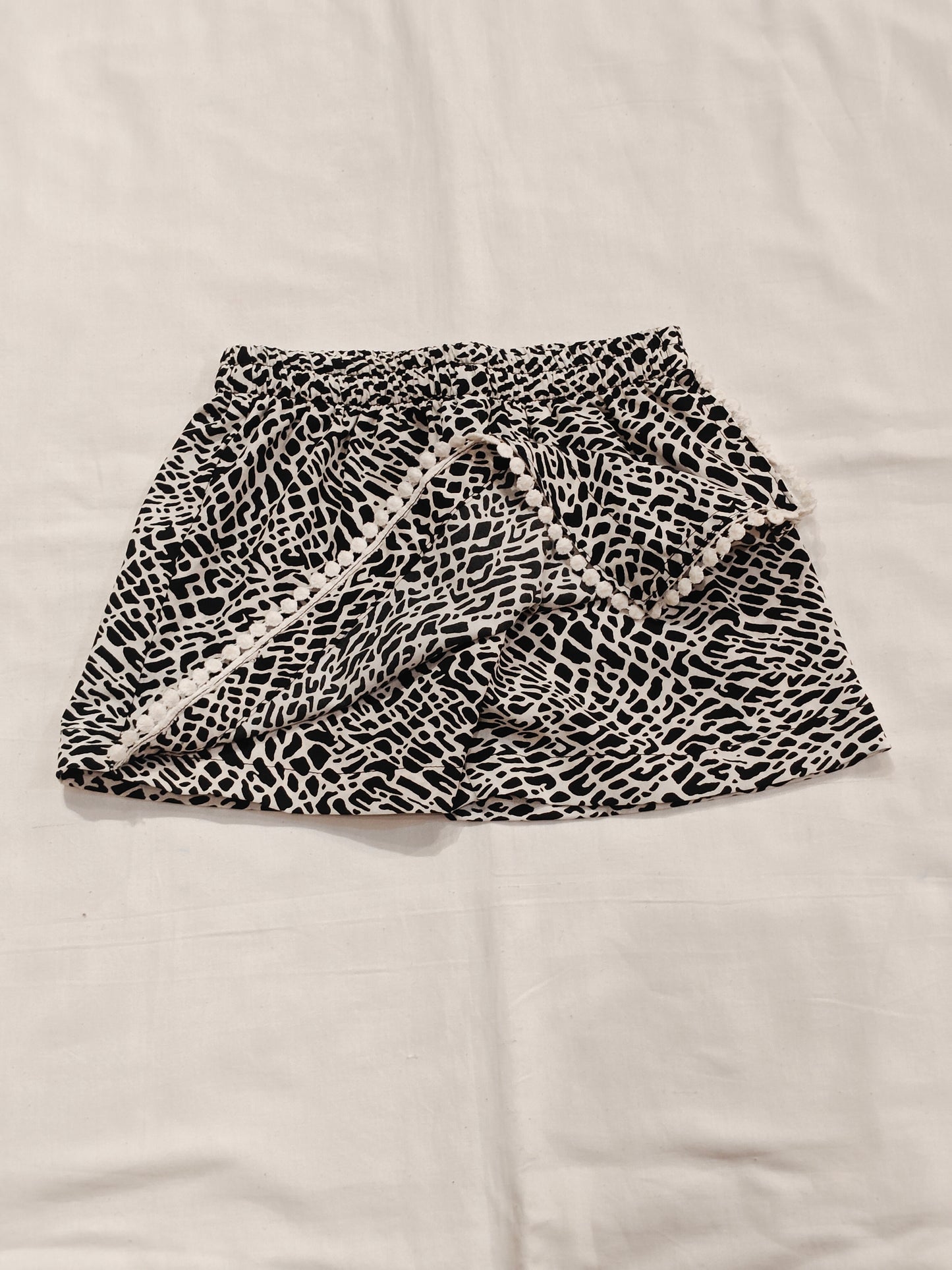 Black n white skort ( skirt style shorts ) with pom pom trims