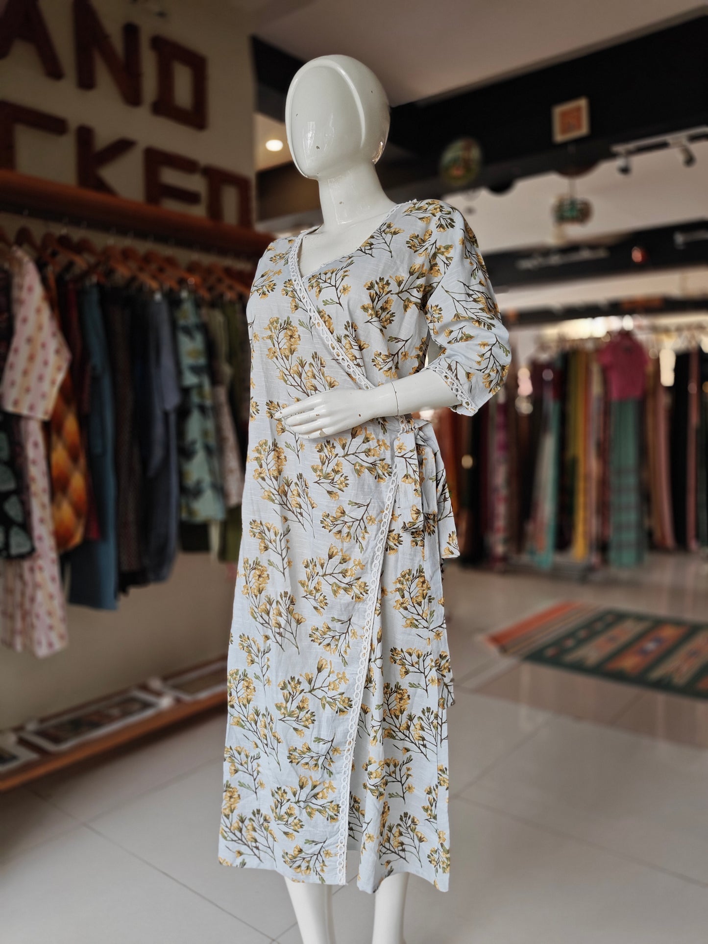 Greyish blue angrakha wrap dress with yellow floral prints and lace borders
