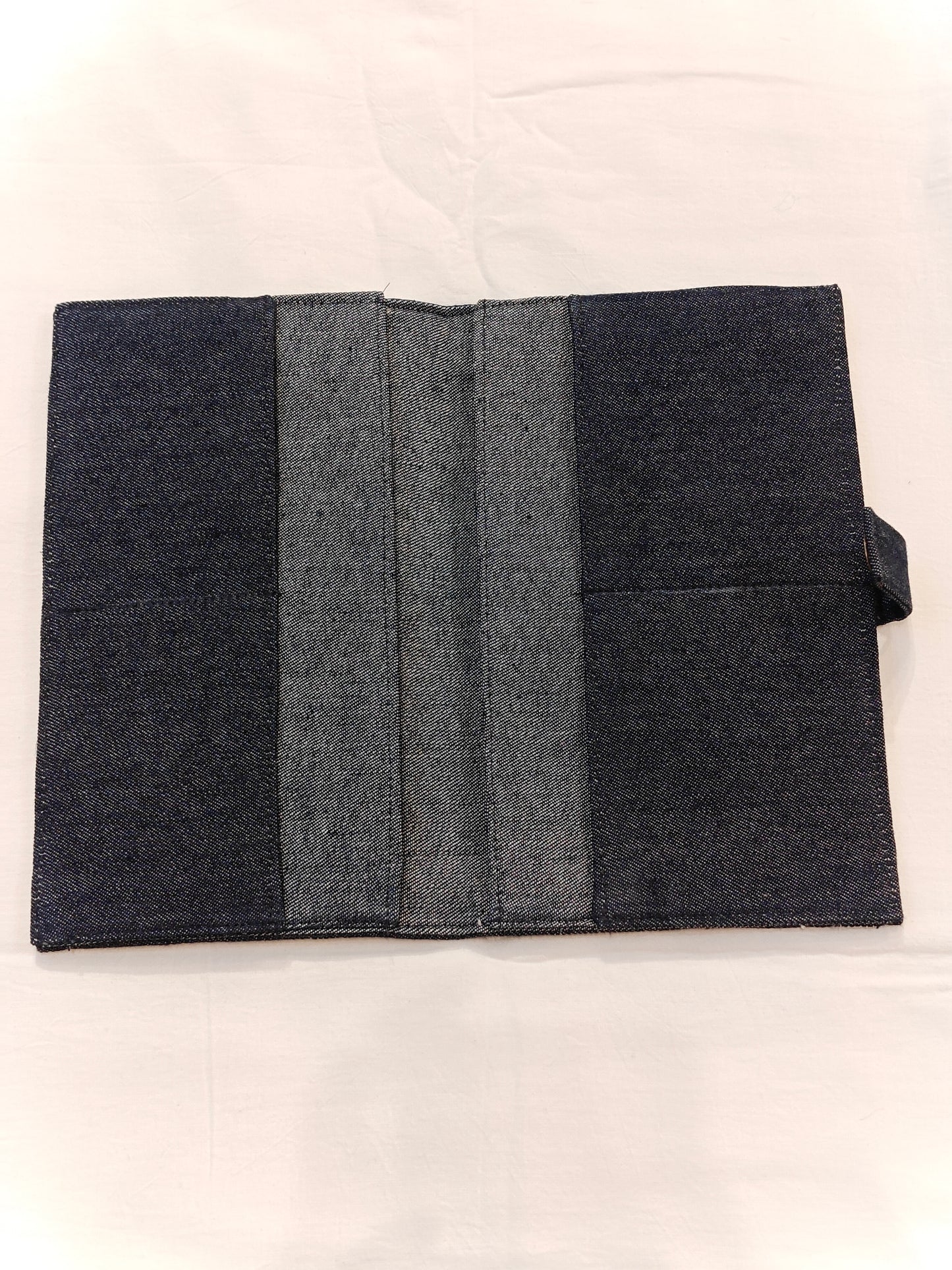 Denim fabric passport featuring embroidered "BON VOYAGE"