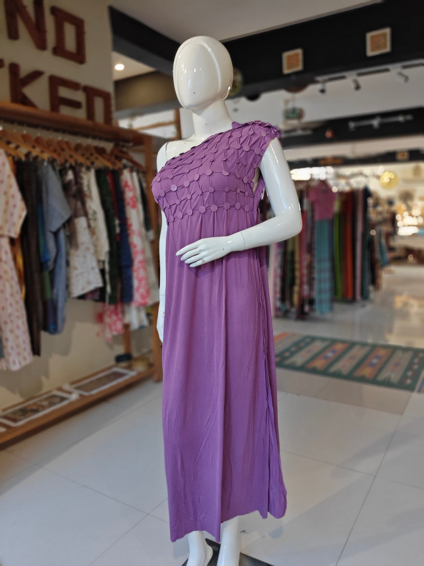 Purple knit dress with buttons to customize the design