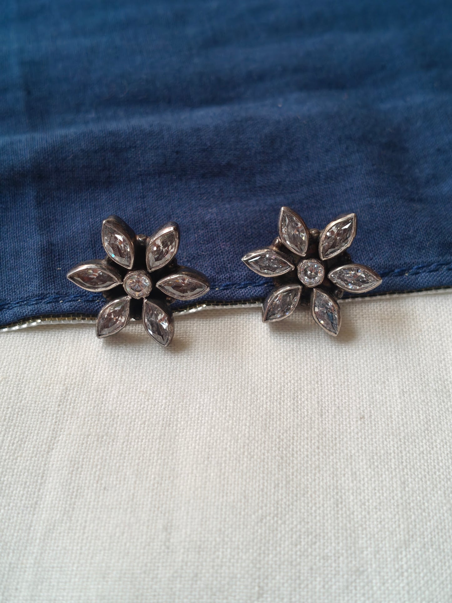 Flower shaped with stone stud earrings in 92.5 sterling silver