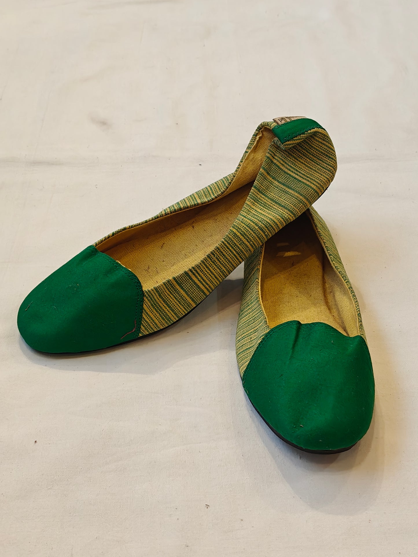 Green and yellow women's shoe with upcycled tyre base