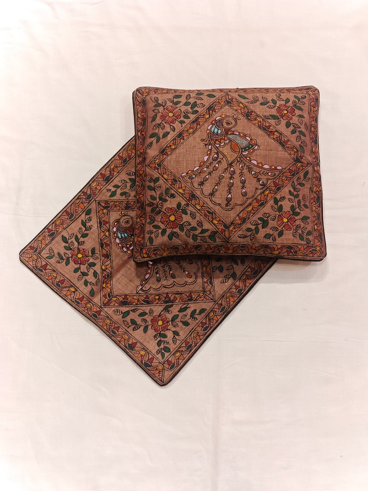 Brown cushion cover with Madhubani peacock hand painted designs