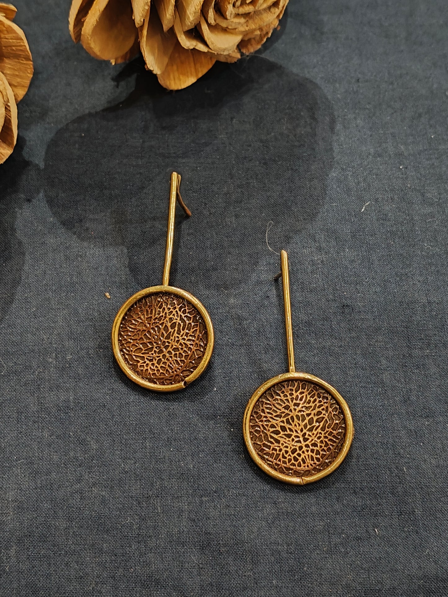 Circular handcrafted stud earrings in copper and brass