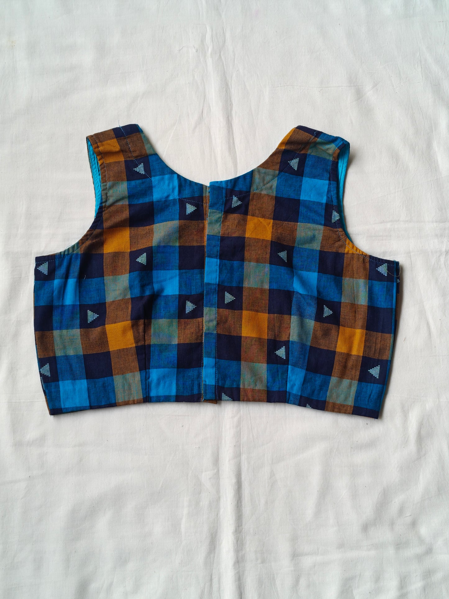 Blue and orange checkered pattern with triangular motifs cotton blouse