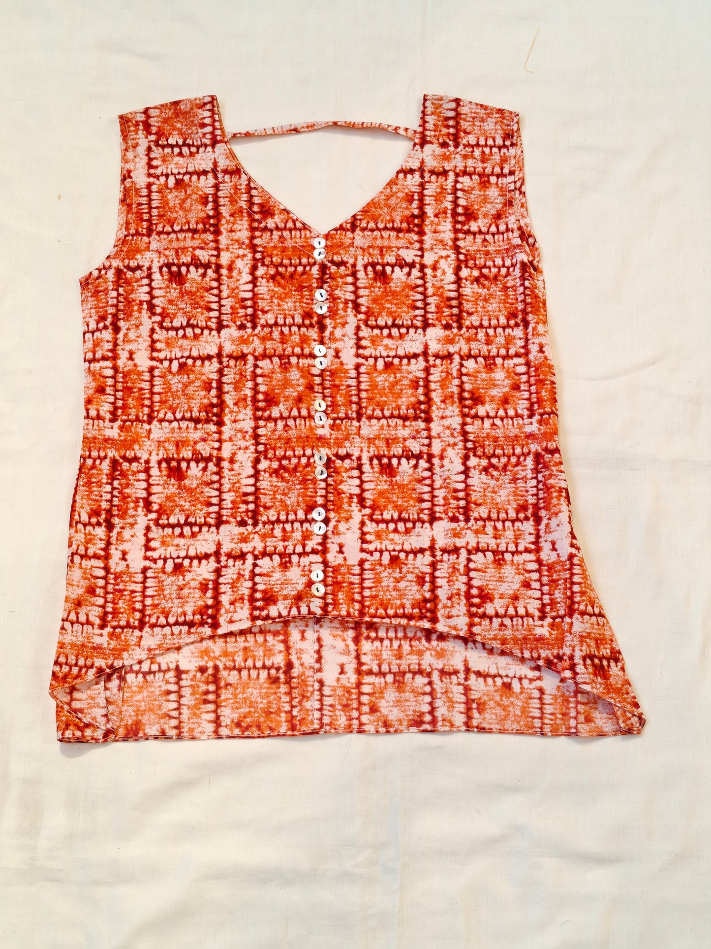 Orange and white printed short top