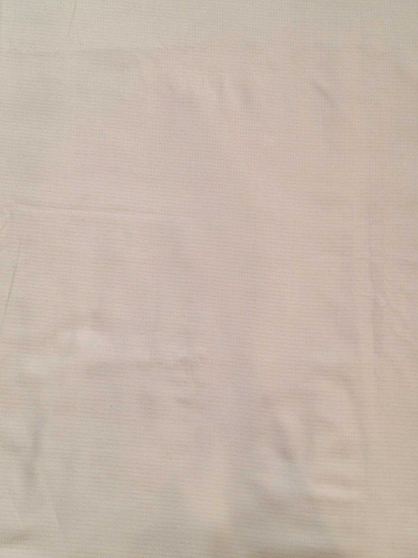 Plain white textured cotton fabric