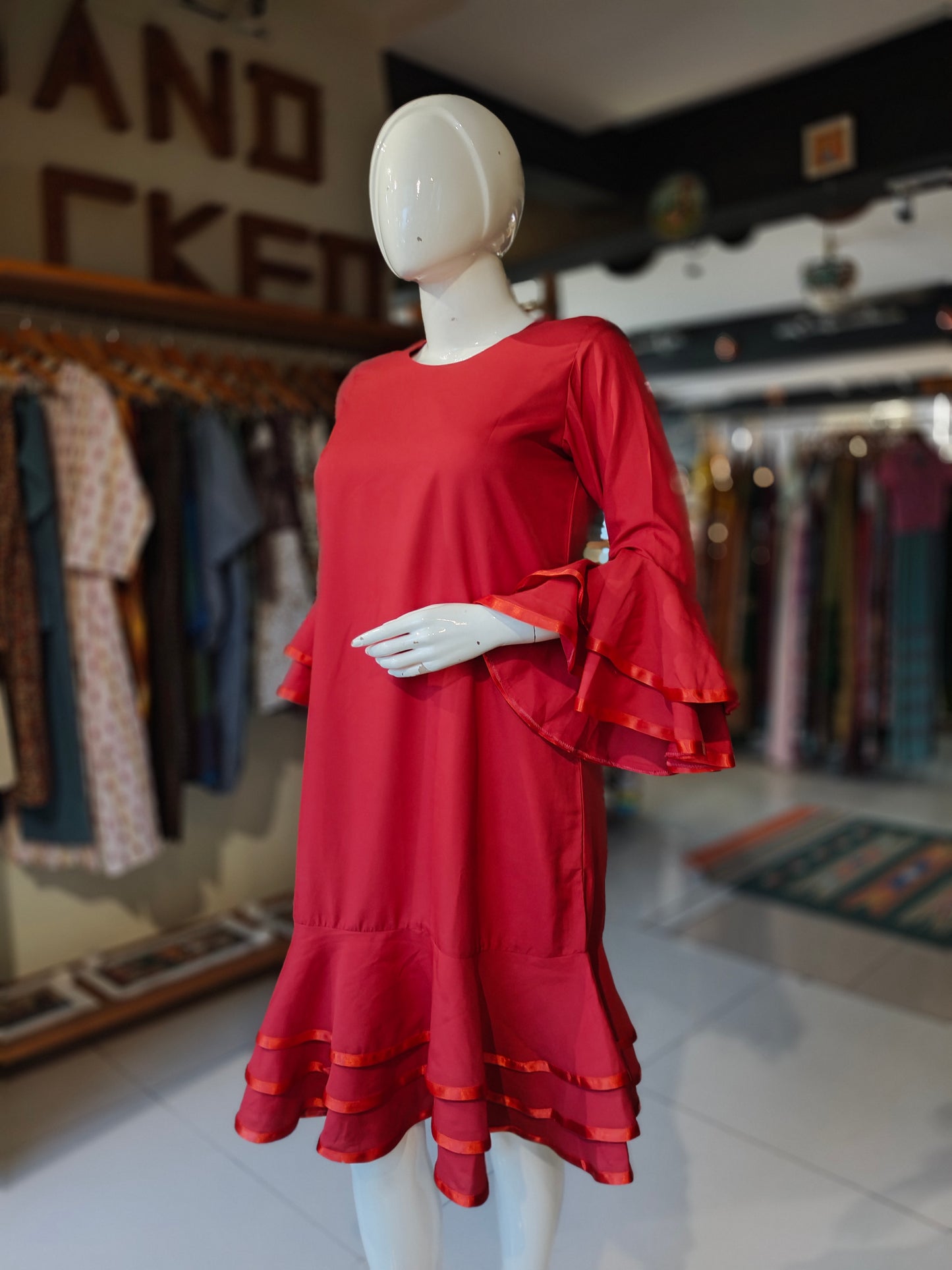 Red elbow sleeved dress with ruffled sleeves and hem ribbon trims